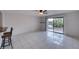 Living area with view of canal from sliding doors at 947 Sunridge Way # A-3, Sarasota, FL 34234