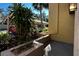 Small patio with potted plants, near parking area at 947 Sunridge Way # A-3, Sarasota, FL 34234