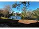 Serene pond with fountain, surrounded by lush greenery at 947 Sunridge Way # A-3, Sarasota, FL 34234