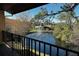 Peaceful pond view from private balcony, featuring a water fountain at 947 Sunridge Way # A-3, Sarasota, FL 34234