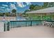 Community pool deck with seating area and shaded patio at 947 Sunridge Way # A-3, Sarasota, FL 34234