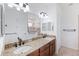 Elegant bathroom featuring double vanity sinks and a glass-enclosed shower at 12928 24Th E Ct, Parrish, FL 34219