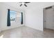 Bedroom with neutral tile flooring, closet and large window with light-blocking curtains at 12928 24Th E Ct, Parrish, FL 34219