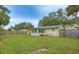 Large backyard with grassy area and wooden fence at 2947 Arrowhead Rd, Venice, FL 34293