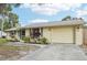 Ranch home with a large driveway and mature tree at 2947 Arrowhead Rd, Venice, FL 34293