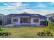 Home exterior showcasing pool and landscaped yard at 8983 Baroque Ter, Sarasota, FL 34240