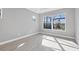 Bright bedroom with wood-look floors and large window at 8983 Baroque Ter, Sarasota, FL 34240