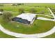 Aerial view of home with pool and large backyard; circular driveway at 3630 Verna Rd, Myakka City, FL 34251
