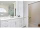 Bathroom with double vanity and walk-in shower at 3630 Verna Rd, Myakka City, FL 34251