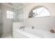 Bathroom featuring a soaking tub and walk-in shower at 3630 Verna Rd, Myakka City, FL 34251