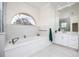 Spa-like bathroom with soaking tub and double vanity at 3630 Verna Rd, Myakka City, FL 34251