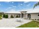 Exterior of house with metal roof, paver patio, and landscaping at 3630 Verna Rd, Myakka City, FL 34251