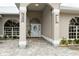 Elegant front entrance with arched entryway and ornate door at 3630 Verna Rd, Myakka City, FL 34251