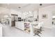 Bright kitchen with white cabinets, center island, and stainless steel appliances at 3630 Verna Rd, Myakka City, FL 34251