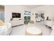 Spacious living area featuring a large TV and comfortable seating at 3630 Verna Rd, Myakka City, FL 34251