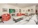 Bright living room featuring ample seating and large TV at 3630 Verna Rd, Myakka City, FL 34251