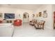 Living area featuring two armchairs and gallery wall at 3630 Verna Rd, Myakka City, FL 34251