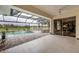 Inviting pool area with covered patio, seating, and tranquil view at 3630 Verna Rd, Myakka City, FL 34251