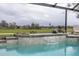 Enjoy the waterfall feature and tranquil view from this pool at 3630 Verna Rd, Myakka City, FL 34251