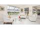 Bright sunroom with comfy seating and view of backyard at 3630 Verna Rd, Myakka City, FL 34251