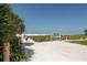 Beach access path with Siesta Beach sign at 1215 S Portofino Dr # 404, Sarasota, FL 34242