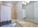 Bathroom with granite countertop and shower/tub combo at 1243 Starboard Ln, Sarasota, FL 34242