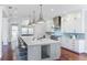 Modern kitchen with white cabinets, large island and stainless steel appliances at 1243 Starboard Ln, Sarasota, FL 34242