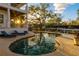 Stunning sunset view over the pool and canal at 1243 Starboard Ln, Sarasota, FL 34242