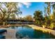 Inviting pool and spa with lush landscaping at 1243 Starboard Ln, Sarasota, FL 34242