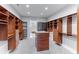 Large walk-in closet with ample shelving and drawers at 1243 Starboard Ln, Sarasota, FL 34242