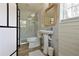 Clean bathroom with pedestal sink, shower, and modern tile at 1318 6Th W St, Palmetto, FL 34221