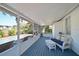 Relaxing screened porch with seating area overlooking the pool at 1318 6Th W St, Palmetto, FL 34221