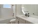 Clean bathroom, featuring a bathtub, toilet and modern vanity at 2528 Star Apple Way, Sarasota, FL 34240