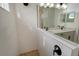 Modern bathroom with double vanity, frameless shower, and white subway tile at 2528 Star Apple Way, Sarasota, FL 34240