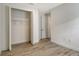 Simple bedroom with wood-look tile floors and a closet at 2528 Star Apple Way, Sarasota, FL 34240