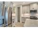 Modern kitchen with stainless steel appliances and ample cabinet storage at 2528 Star Apple Way, Sarasota, FL 34240