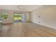 Living room with tile flooring and sliding glass doors leading to the backyard at 2528 Star Apple Way, Sarasota, FL 34240