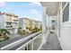 Balcony with white railing offering a view of the neighborhood at 4322 Marina View Way, Cortez, FL 34215