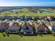 Aerial view of the real estate, highlighting the beautiful pool and surrounding landscaping at 5553 Mulligan Way, Bradenton, FL 34211