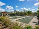 Enjoy the community bocce ball court, surrounded by lush landscaping and blue skies at 5553 Mulligan Way, Bradenton, FL 34211