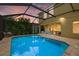 Inviting swimming pool with a covered patio and comfortable seating at 12224 Longview Lake Cir, Bradenton, FL 34211