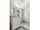 Elegant bathroom with marble tile and a walk-in shower at 4511 Bay Shore Rd, Sarasota, FL 34234