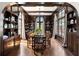 Elegant dining room with dark wood accents and large windows at 4511 Bay Shore Rd, Sarasota, FL 34234