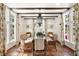 Bright dining room featuring a glass table and wicker chairs at 4511 Bay Shore Rd, Sarasota, FL 34234