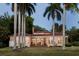 Back view of the house showcasing its architecture and landscaping at 4511 Bay Shore Rd, Sarasota, FL 34234