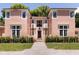 Another view of the two-story pink house with a walkway at 4511 Bay Shore Rd, Sarasota, FL 34234