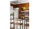 Home bar with wooden walls, shelving, and leather stools at 4511 Bay Shore Rd, Sarasota, FL 34234