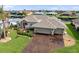 Stunning two-story home with three-car garage and manicured lawn at 5234 Cooper Ter, Port Charlotte, FL 33981