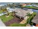 Aerial view of a house with a large driveway and canal views at 5234 Cooper Ter, Port Charlotte, FL 33981