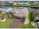 An aerial view of a single Gathering home with a three car garage at 5234 Cooper Ter, Port Charlotte, FL 33981